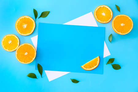 Sweet oranges and blank cards on color backgroundの写真素材