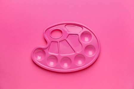 Artist's palette on pink backgroundの写真素材