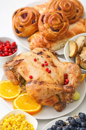 Tasty baked turkey and different food for Thanksgiving day on tableの写真素材