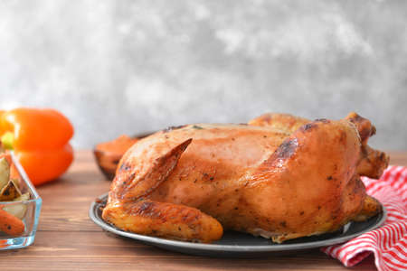 Tasty baked turkey for Thanksgiving day on tableの写真素材