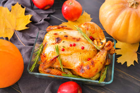 Tasty baked turkey for Thanksgiving day on tableの写真素材