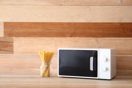 Modern microwave oven in kitchenの写真素材