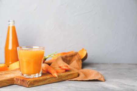 Glass of fresh vegetable juice on tableの写真素材