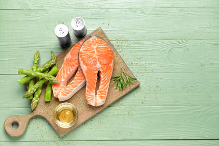 Composition with raw salmon steaks on tableの写真素材