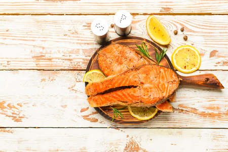 Tasty fried salmon on tableの写真素材