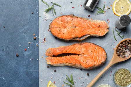 Composition with fried salmon on tableの写真素材