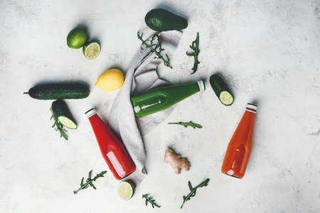 Bottles of fresh vegetable juices on white backgroundの写真素材