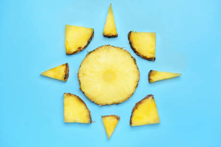 Fresh cut pineapple on color background
