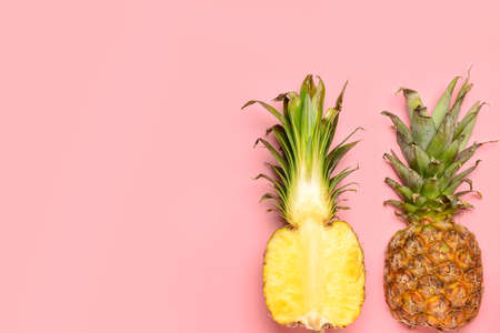 Fresh ripe pineapples on color backgroundの写真素材