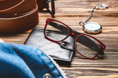 Set of male clothes and accessories on wooden backgroundの写真素材
