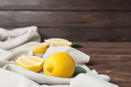 Fresh ripe lemons on wooden tableの写真素材