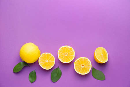 Ripe lemons on color backgroundの写真素材