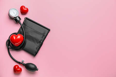 Sphygmomanometer with red hearts on color backgroundの写真素材