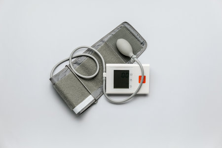 Electronic sphygmomanometer on light backgroundの写真素材