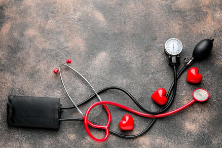 Composition with sphygmomanometer on grunge backgroundの写真素材