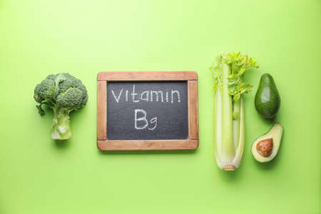 Healthy products rich in vitamin B9 on color backgroundの写真素材