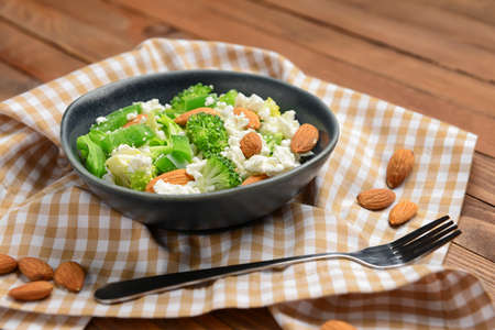 Bowl with tasty salad on tableの写真素材