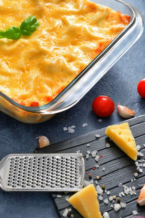 Tasty lasagna on dark backgroundの写真素材