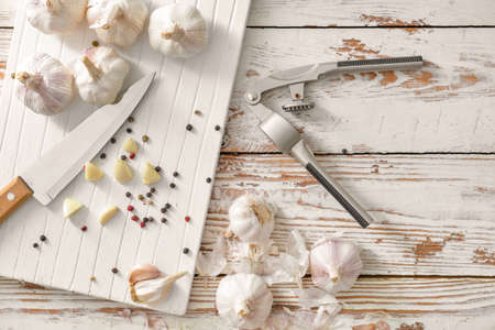 Fresh garlic with spices on wooden tableの写真素材