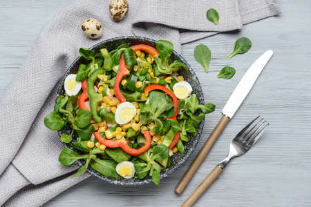 Bowl with tasty salad on tableの写真素材