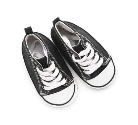 Baby booties on white background