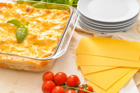 Composition with tasty homemade lasagna on tableの写真素材