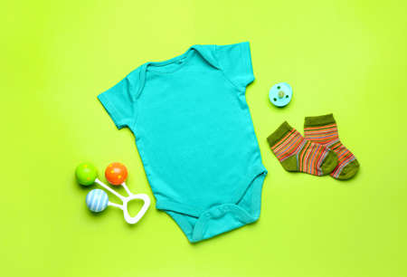 Baby clothes and accessories on color backgroundの写真素材