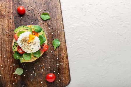 Sandwich with poached egg on white backgroundの写真素材