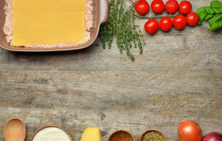 Ingredients for lasagna on wooden backgroundの写真素材