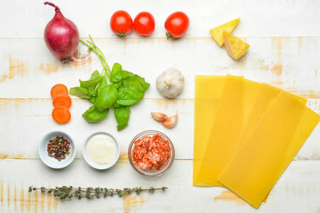 Ingredients for lasagna on white wooden backgroundの写真素材