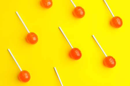 Tasty lollipops on color backgroundの写真素材
