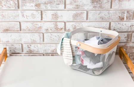Basket with socks on table