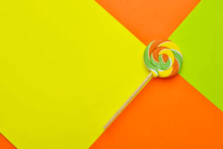 Tasty lollipop on color backgroundの写真素材
