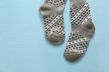 Knitted socks on color backgroundの写真素材