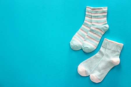 Different cotton socks on color backgroundの写真素材