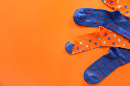 Different cotton socks on color backgroundの写真素材