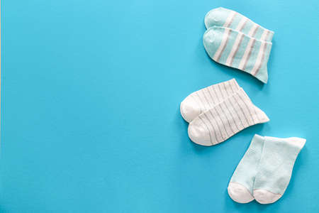 Different cotton socks on color backgroundの写真素材