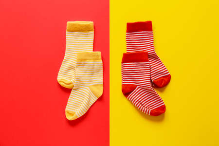 Different cotton socks on color backgroundの写真素材