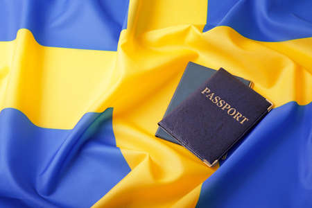 Passports on flag of Sweden. Immigration concept