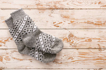 Knitted socks on wooden backgroundの写真素材