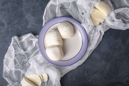 Plate with mozzarella cheese on dark backgroundの写真素材
