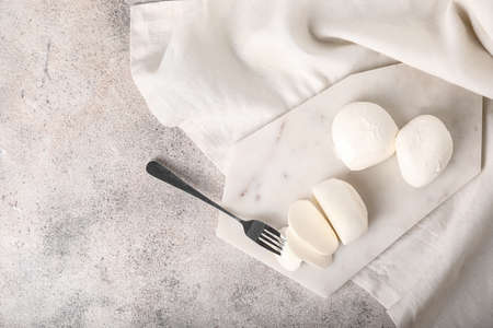 Mozzarella cheese on light backgroundの写真素材