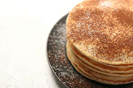 Stack of tasty sweet pancakes on white tableの写真素材