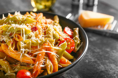 Plate with tasty pasta and cheese on table, closeupの写真素材
