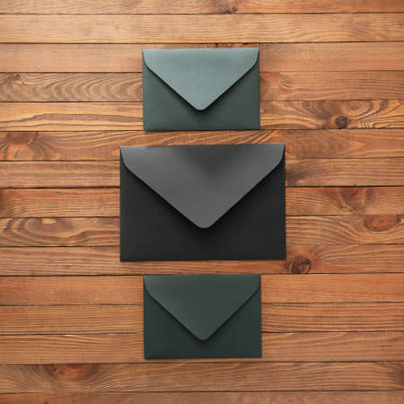 Paper envelopes on wooden background