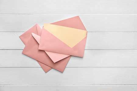 Paper envelopes on wooden backgroundの写真素材