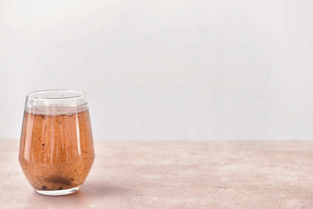 Glass of dirty water on tableの写真素材