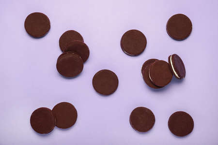 Tasty chocolate cookies on color backgroundの写真素材
