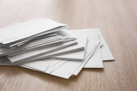 Many paper envelopes on tableの写真素材