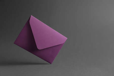 Paper envelope on dark backgroundの写真素材